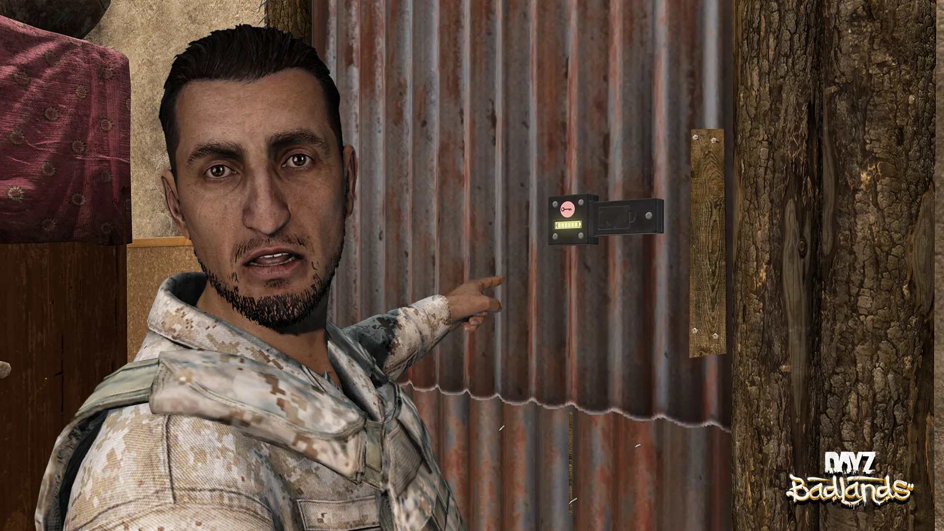 A survivor pointing at a code lock fitted to a corrugated metal door