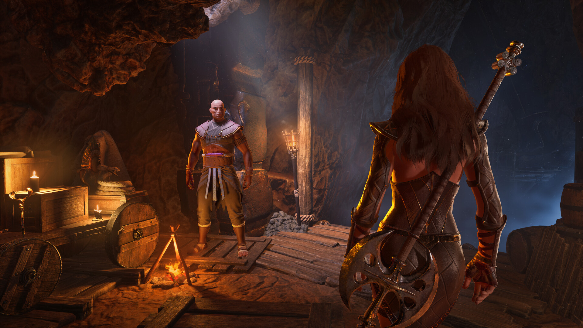 A Conan Exiles character and thrall inside a candlelit base