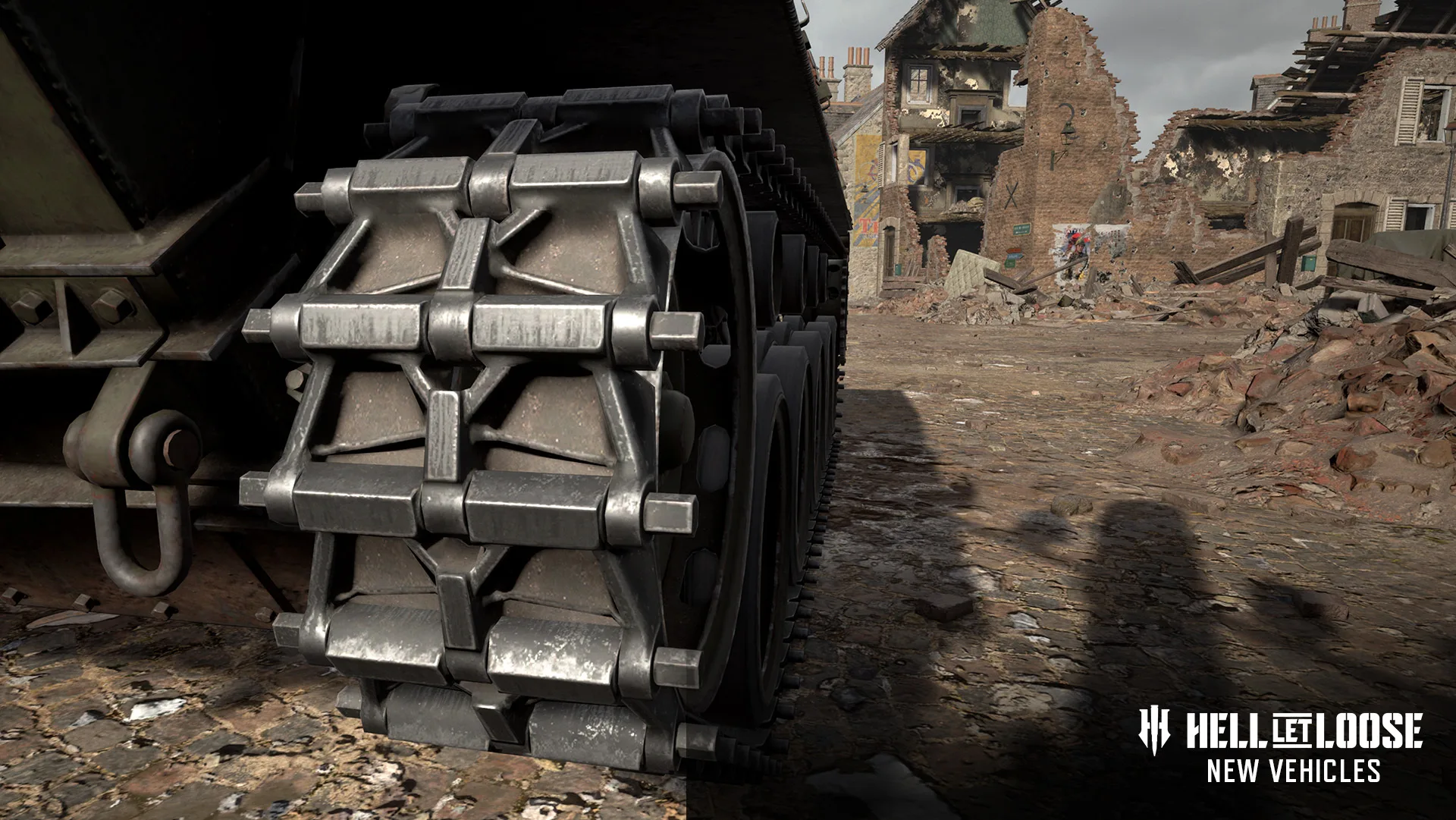 Close-up of a tank's tracks and road wheels on a rubble-strewn street, from the Hell Let Loose new vehicles teaser