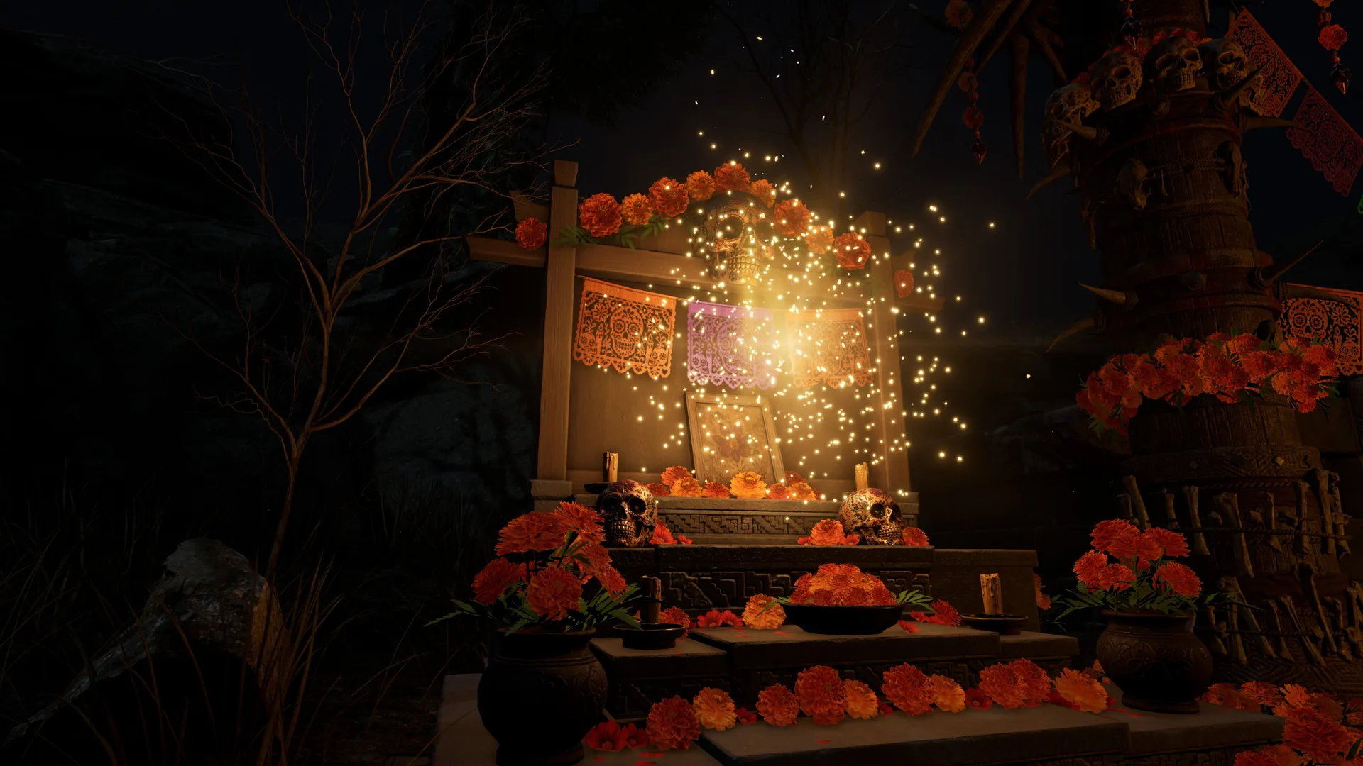 A Marigold Altar at night, lit by candles and surrounded by marigolds and papel picado