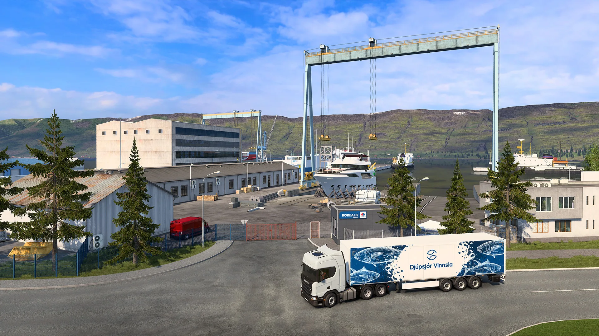 A white truck with a blue trailer at an Icelandic harbour depot
