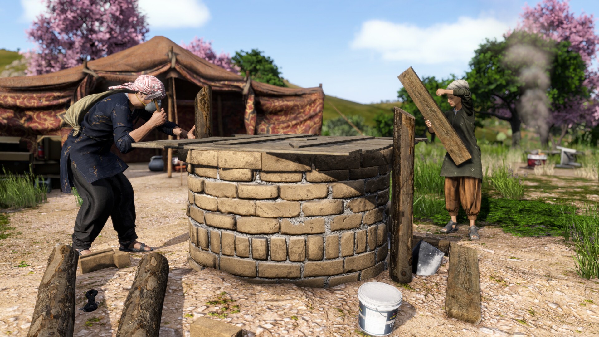 A survivor rebuilding a stone well in a Nasdara village