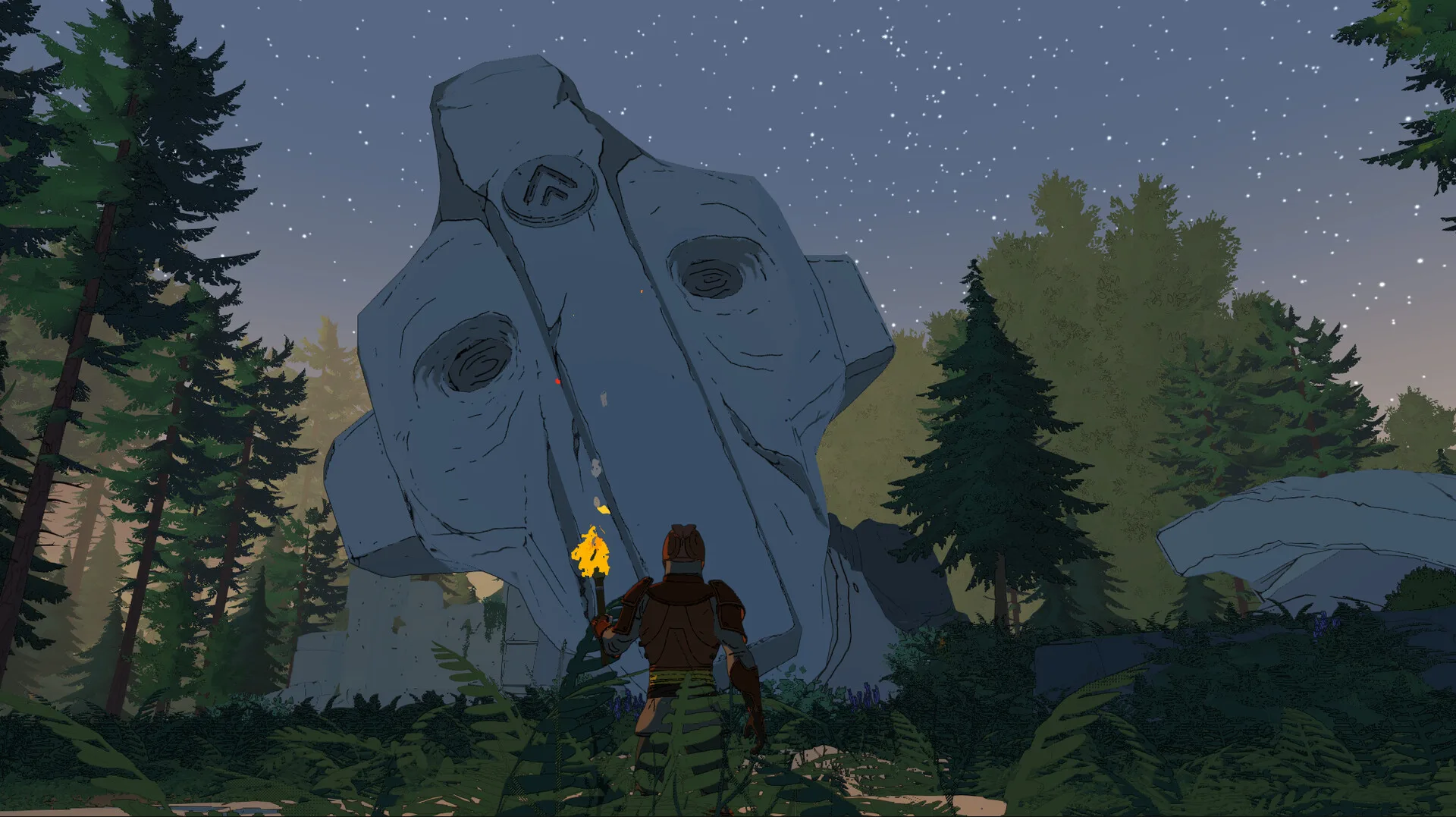 A lone player holding a torch in a pine forest at night, looking up at the fallen stone head of a titan